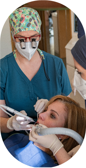 A picture of Dr. Anna Lagou working with a patient